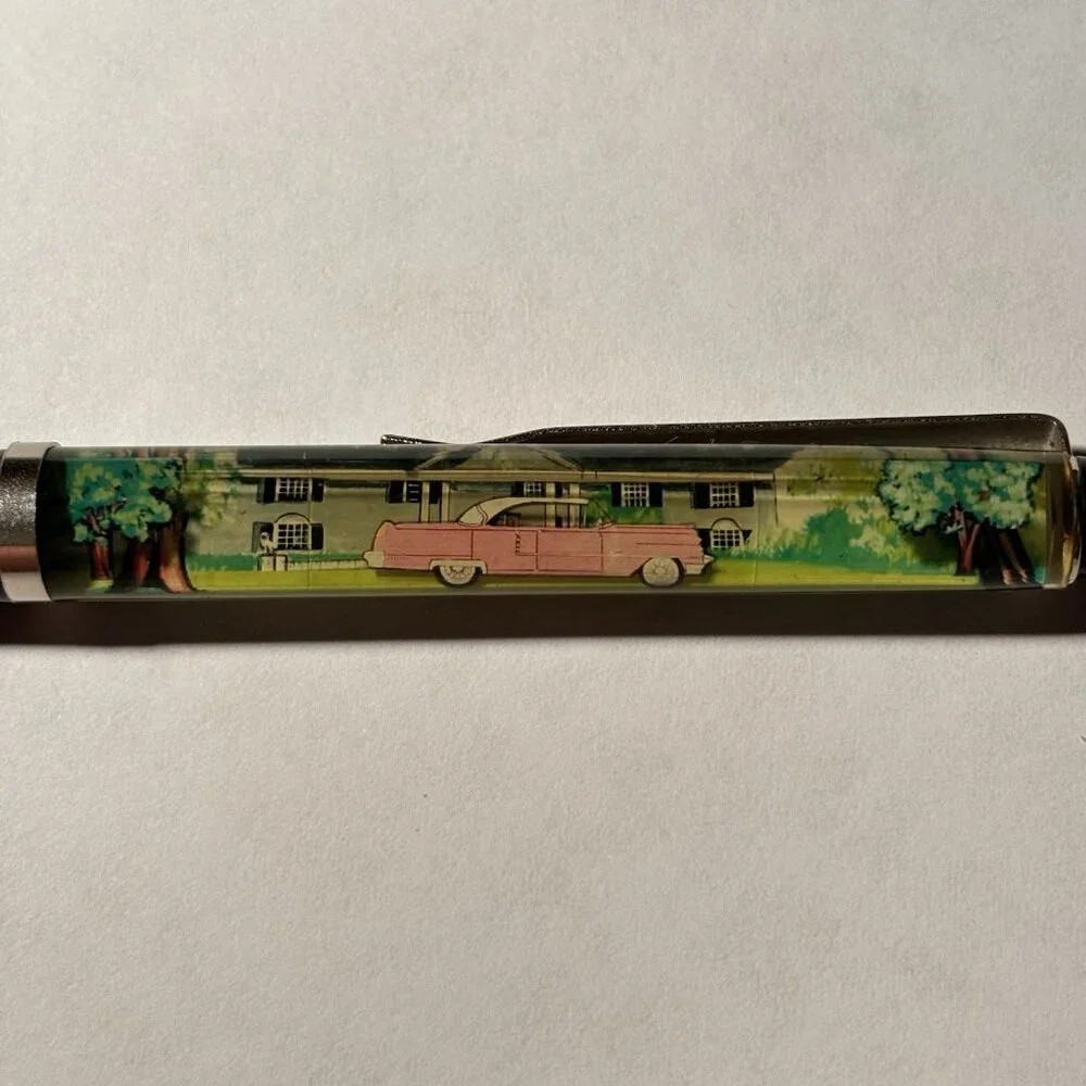 Graceland Floaty Pen Home of Elvis Presley Pink Cadillac Moves Souvenir Novelty